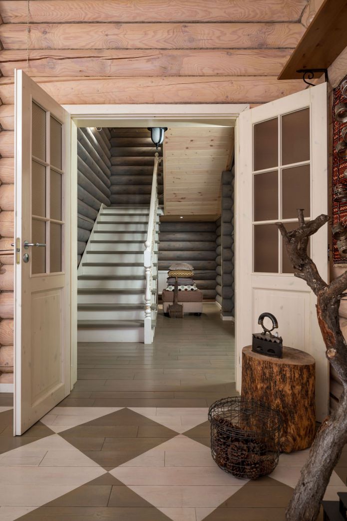 design of the entrance hall in a wooden log house