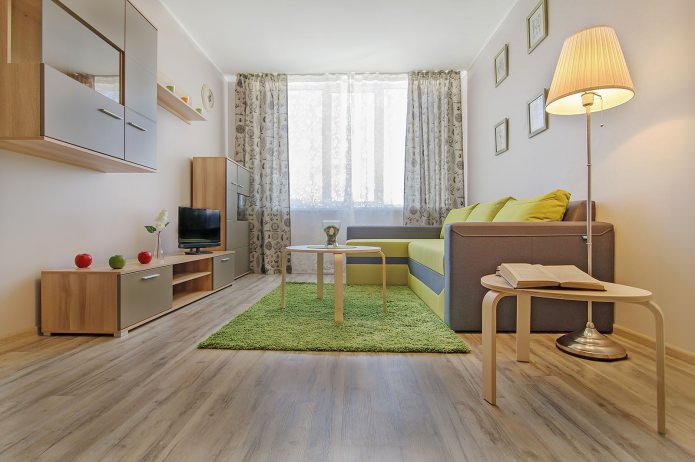 dzīvojamā istaba studijas tipa dzīvokļa interjerā 42 kvadrātmetru platībā. m