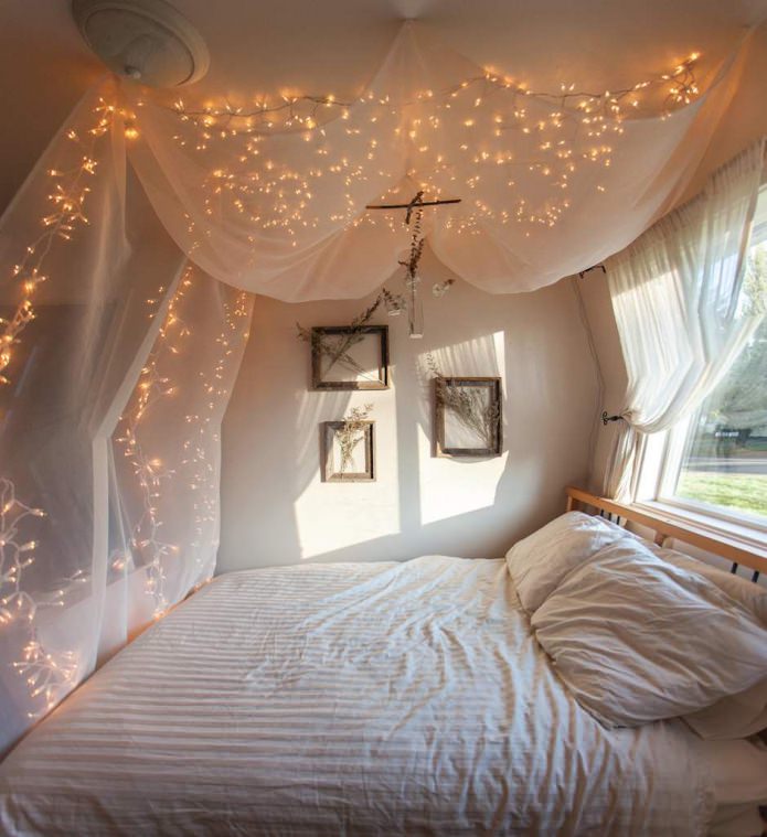 translucent fabric with a garland: bed canopy