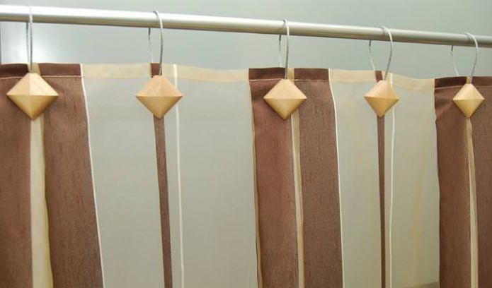 grampos magnéticos para fixação das cortinas do banheiro