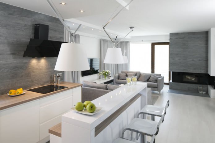 Kahvaltı barı olan modern bir mutfak-oturma odası tasarımı