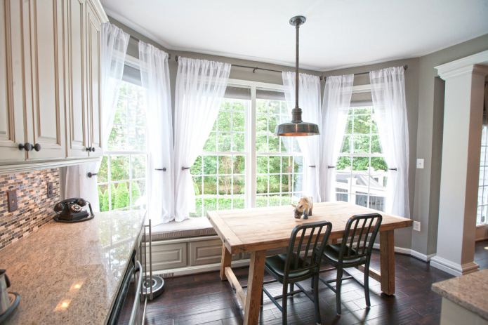 Classic short curtains in the interior of the kitchen