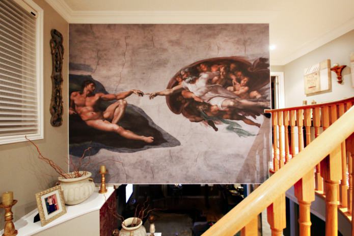 freska ar Mikelandželo gleznas “Ādama radīšana” reprodukciju