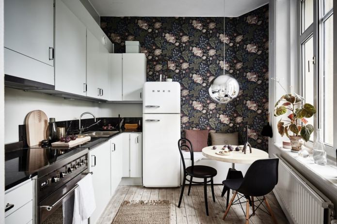 dark wallpaper with a large floral pattern in the kitchen