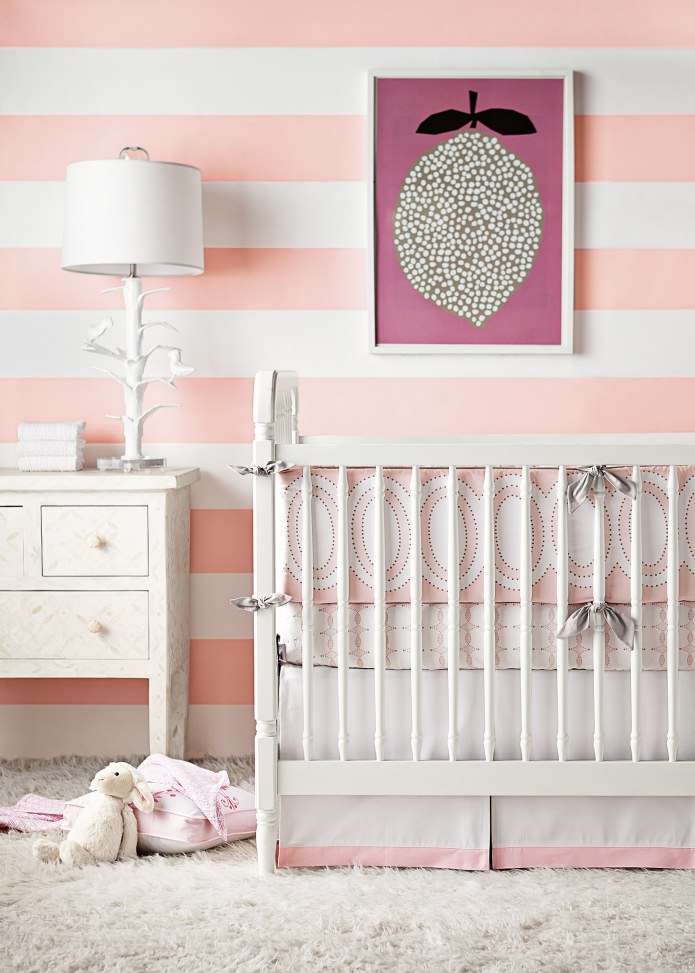 Pink striped wallpaper in a nursery