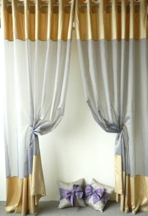 curtains on eyelets with a fringing