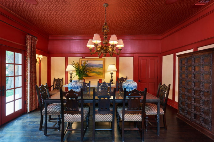 red dining room with patterns on the ceiling
