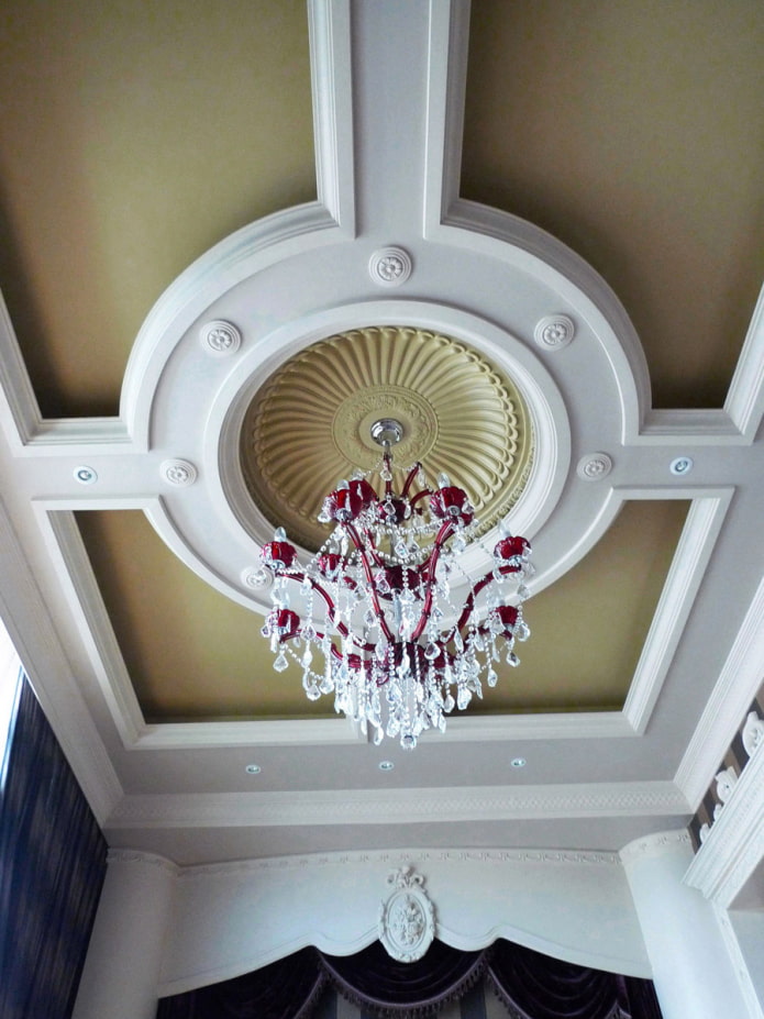 stucco decoration on the ceiling under the chandelier