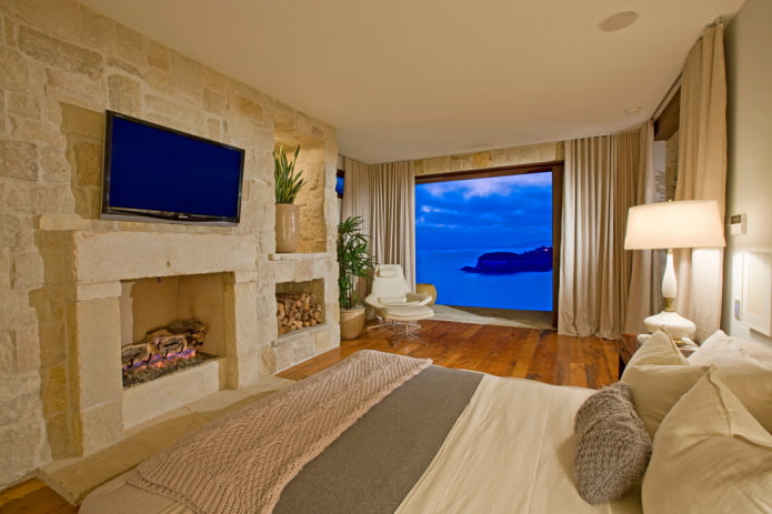 tv in bedroom interior with fireplace