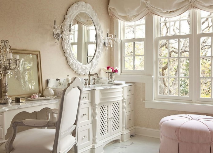 oval-shaped mirror in the interior of the bathroom