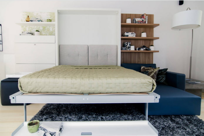 armario cama con sofá en el interior