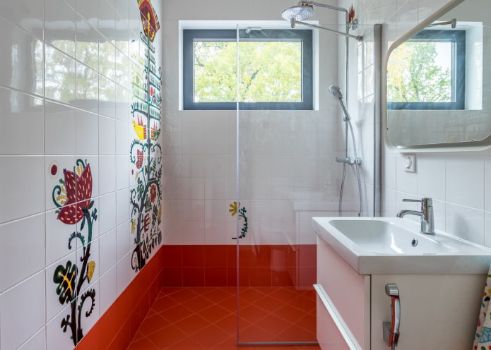 white tiles with drawings in the interior of the bathroom