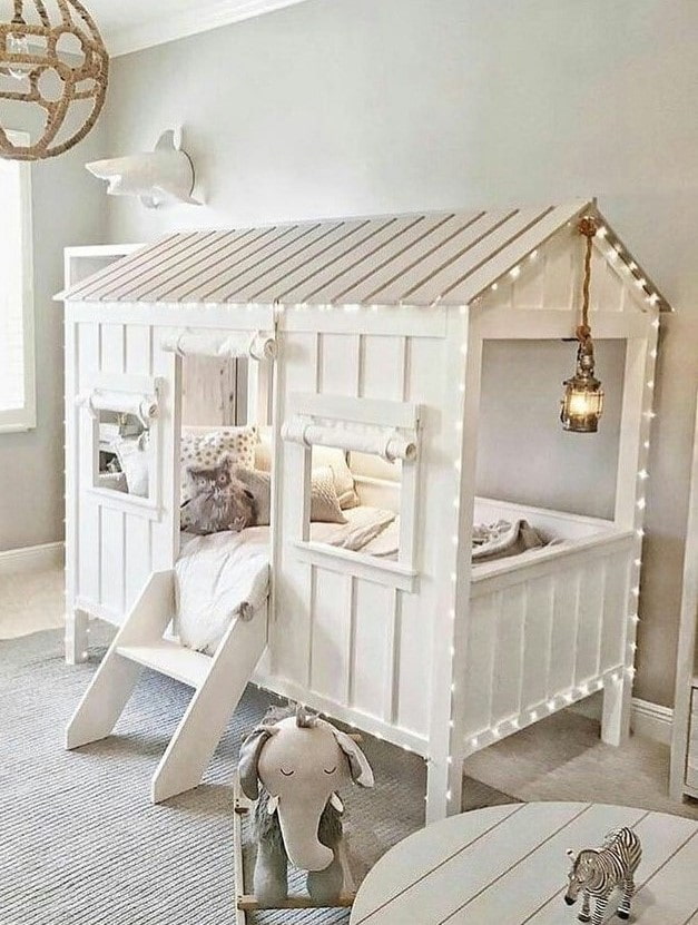 bed in the form of a house in the nursery