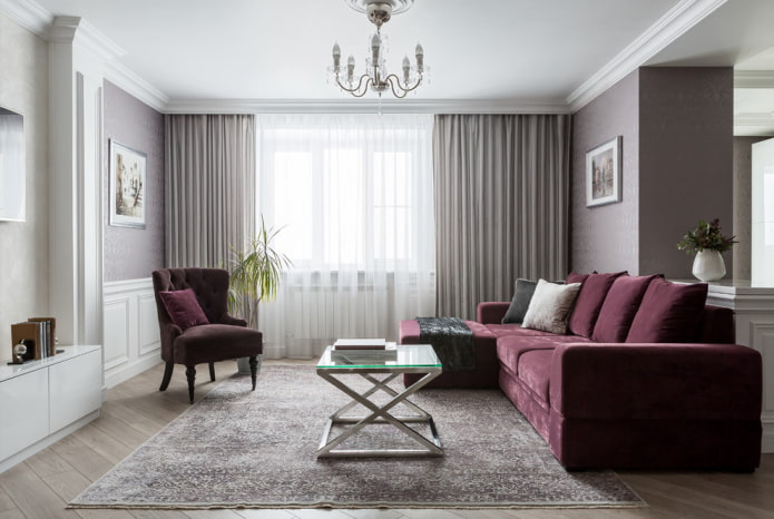 purpurinė sofa su ottomanu