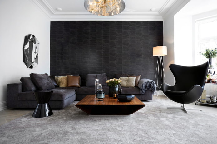 narożna sofa z tapicerką w kolorze szaro-czarnym