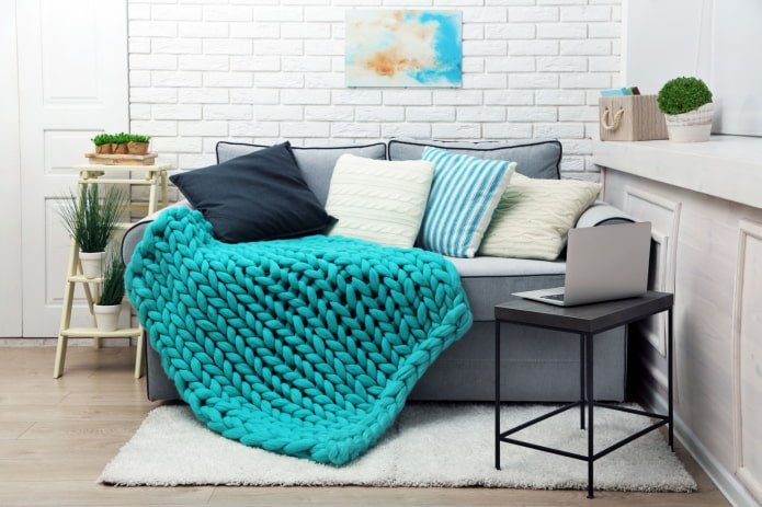 knitted bedspread for sofa in the interior