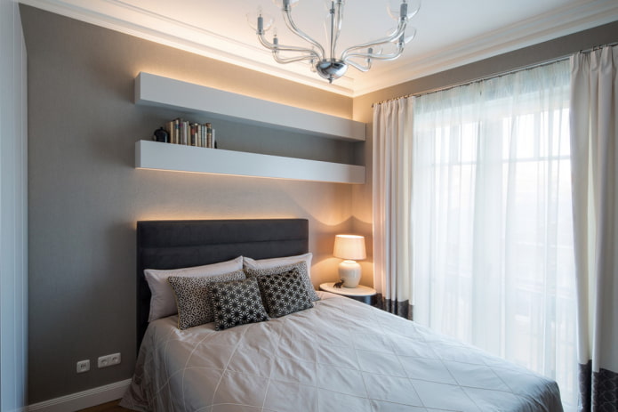 shelves over the bed in the bedroom interior