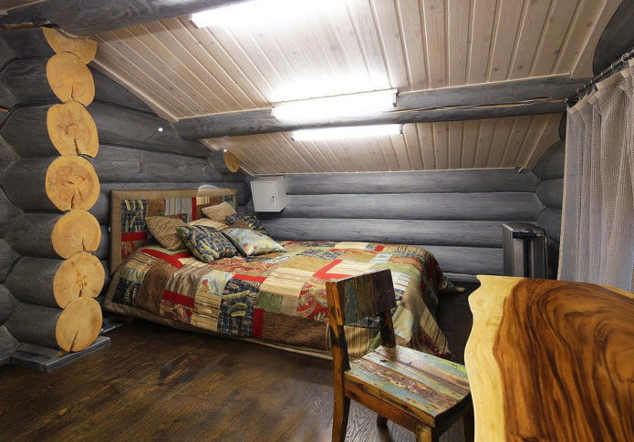diseño de dormitorio en el interior de una casa de troncos