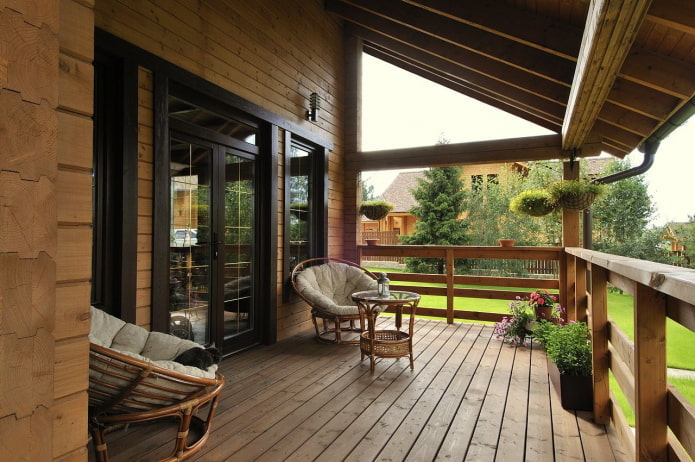 log house design with a veranda