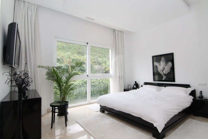 dekor og belysning av soverommet i svart og hvitt