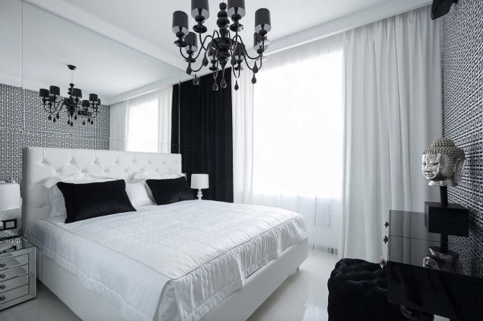 tekstila guļamistabas interjerā melnbaltā krāsā