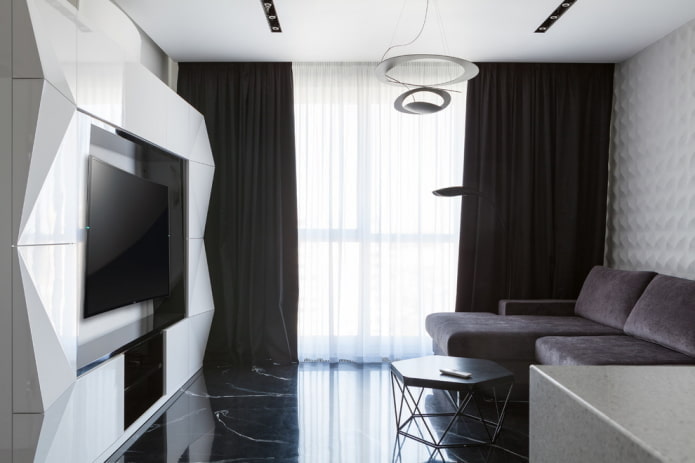 mēbeles un tekstilizstrādājumi viesistabā melnbaltā krāsā