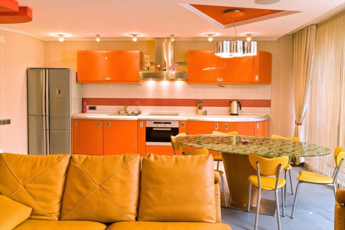interior design of a kitchen-living room in orange tones
