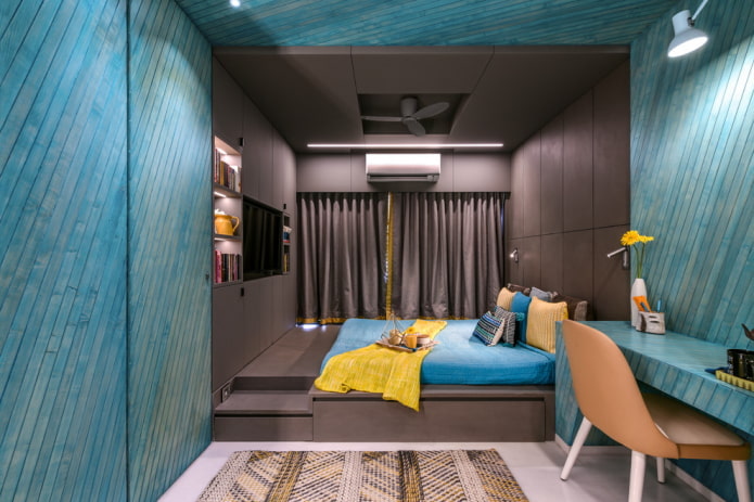 Interior dormitori marró i blau