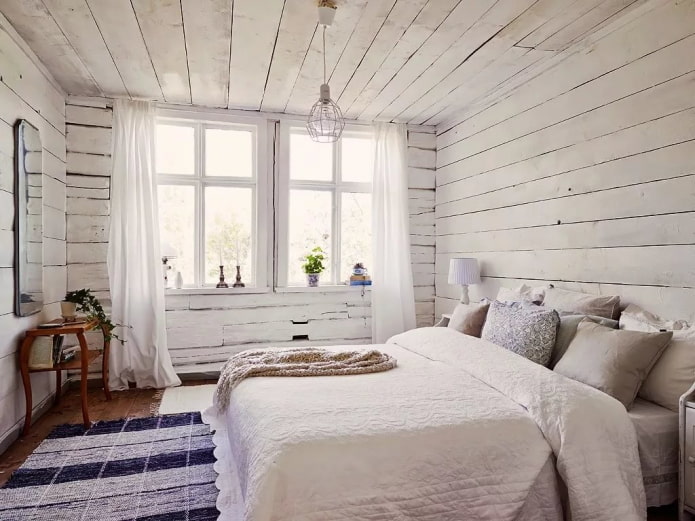 Chambre scandinave dans un intérieur de maison en bois