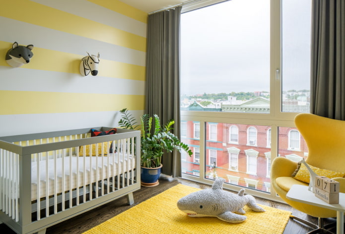 the color scheme in the design of the nursery for the baby