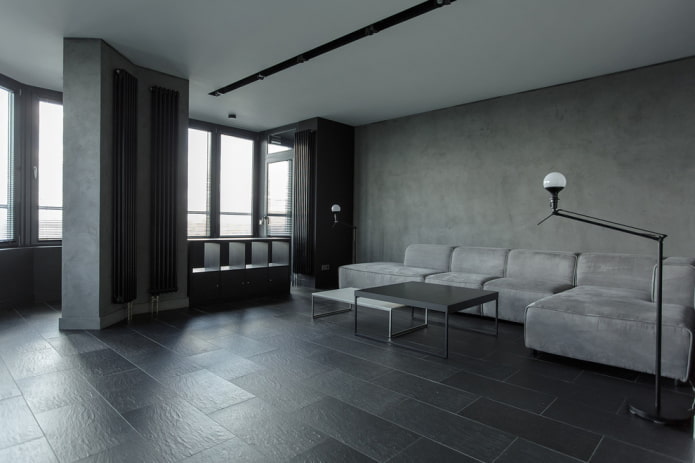minimalistisk inredning i ett grått vardagsrum