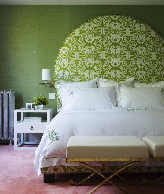 plants on the wallpaper at the head of the bed