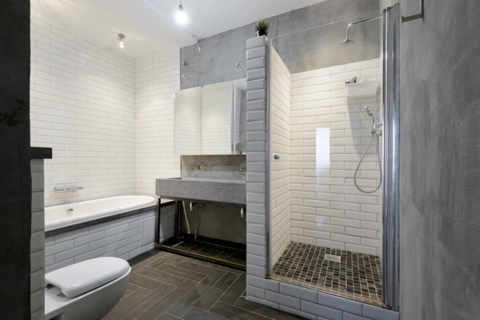 combinação de azulejos e concreto no banheiro