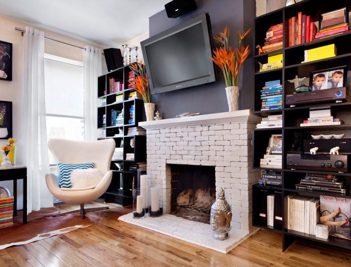 white raised fireplace in the living room interior