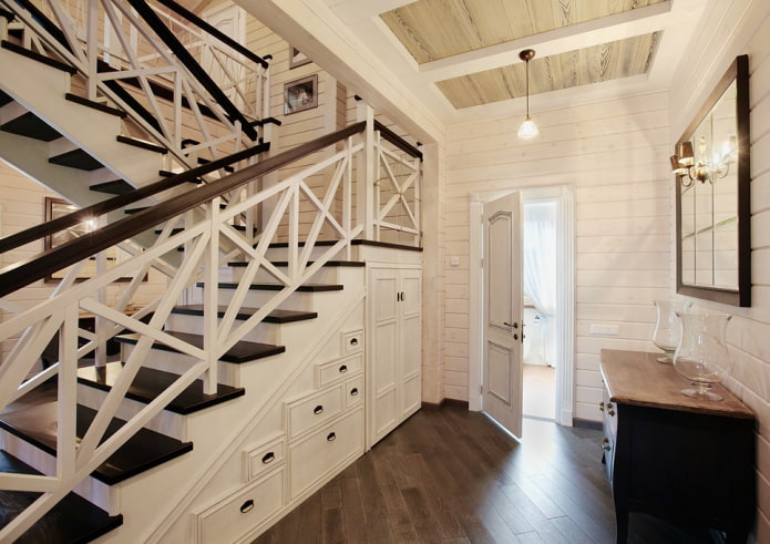 dvoupatrový dřevěný dům s pochodovým dřevěným schodištěm