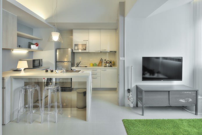 nhà bếp với một quầy bar trong thiết kế nội thất của một căn hộ studio