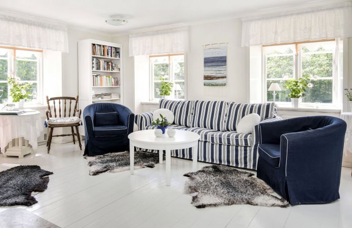 the interior of the living room in blue and white