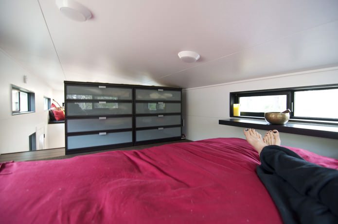 bedroom in a mobile home with a trailer