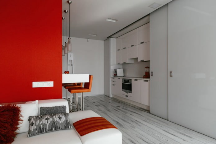 Бар брояч в интериора на кухнята-хол в бели и червени цветове