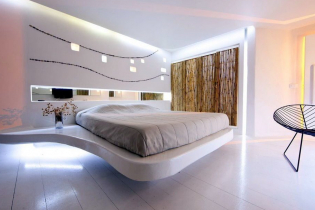 Svävande säng i interiören: typer, former, design, bakgrundsbelysta alternativ