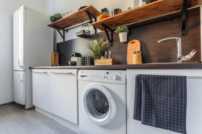 Oversigt over de bedste løsninger til placering af en vaskemaskine i køkkenet
